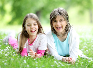 Mother and daughter outdoors